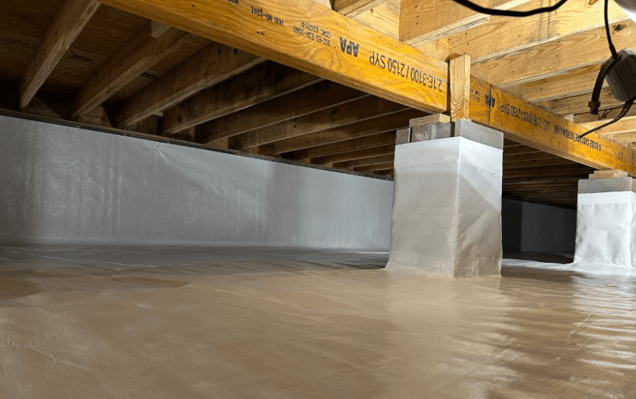 Clean encapsulated crawlspace with a sealed vapor barrier covering the floor, foundation walls, and support piers beneath exposed floor joists.