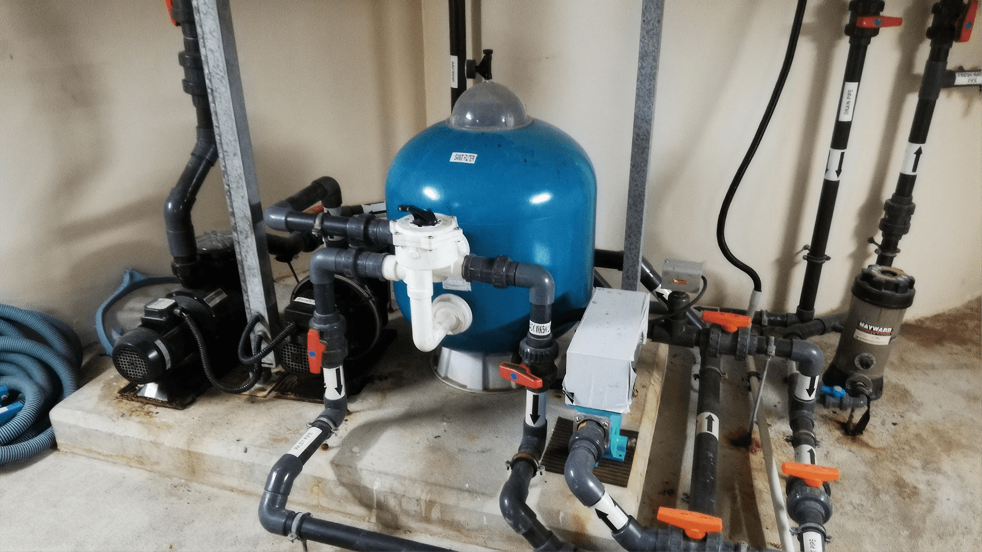 Sump pump system with pumps, filtration equipment, and connected plumbing designed to collect and remove groundwater to help keep basements and crawlspaces dry.